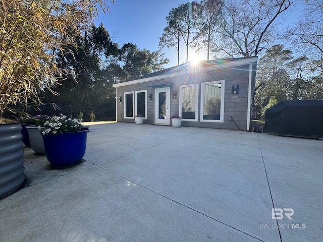 rear view of house featuring a patio