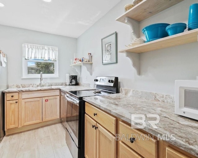 kitchen with electric range, light brown cabinets, open shelves, and a sink