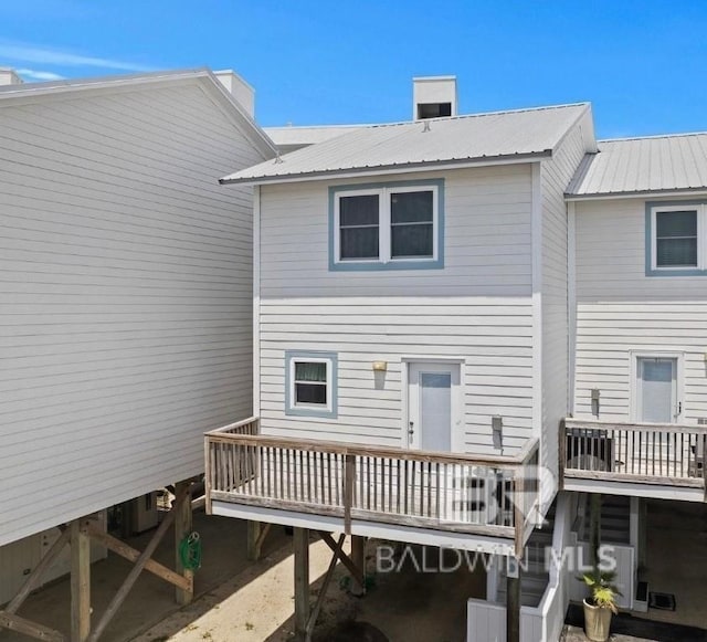 back of property with metal roof