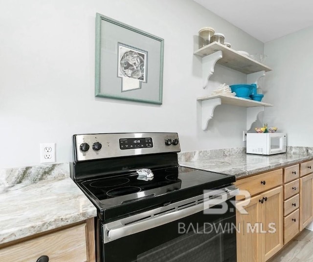 kitchen featuring electric stove, open shelves, light brown cabinetry, white microwave, and light stone countertops