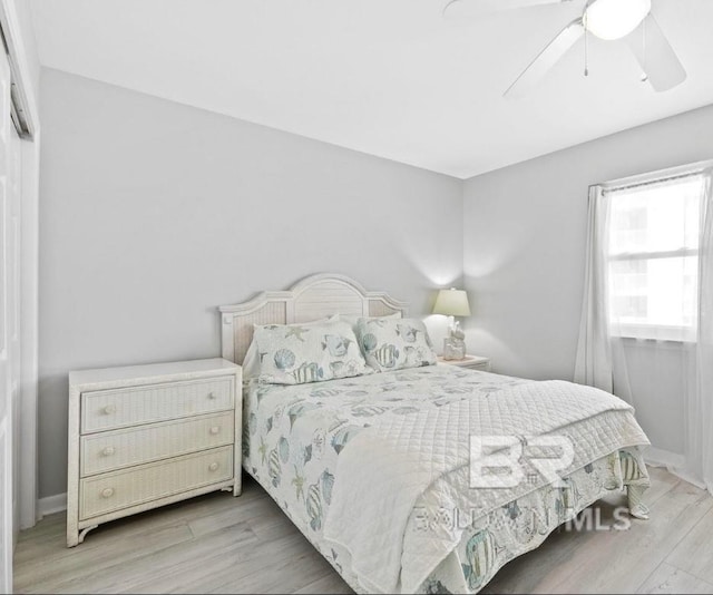 bedroom featuring ceiling fan and wood finished floors