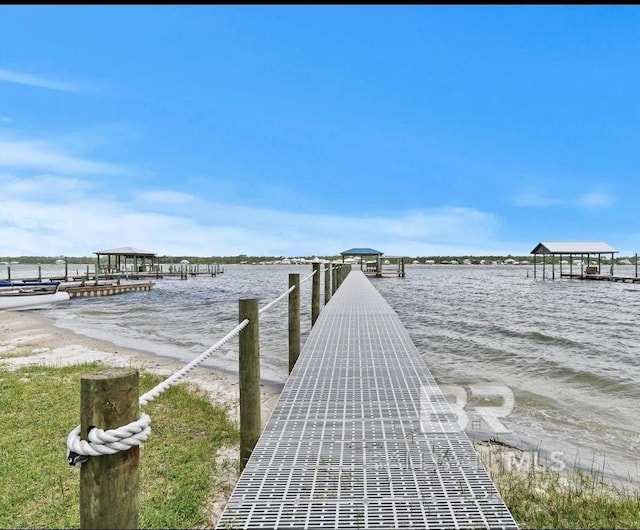 dock area with a water view and a gazebo