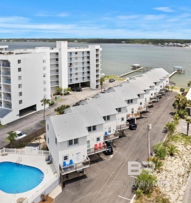 birds eye view of property with a water view