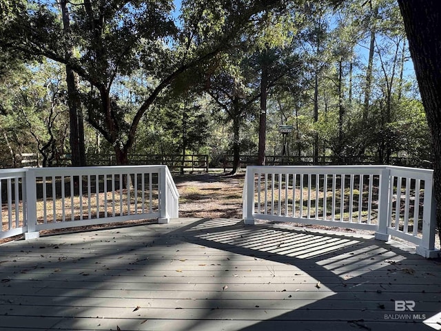 7228 Fairmont Dr, Foley, AL 36535 - wooden terrace with view of wooded area