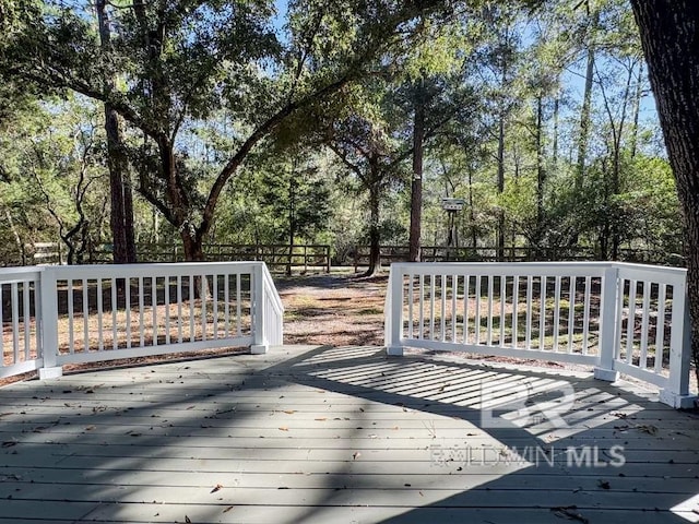 7228 Fairmont Dr, Foley, AL 36535 - deck featuring view of wooded area