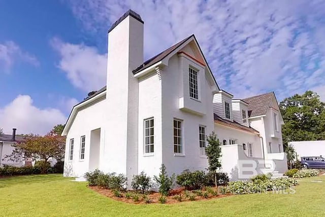 view of home's exterior featuring a yard