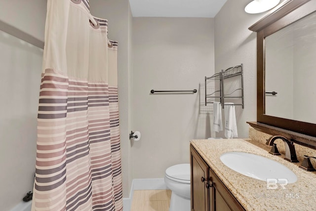 bathroom with vanity, tile patterned floors, and toilet