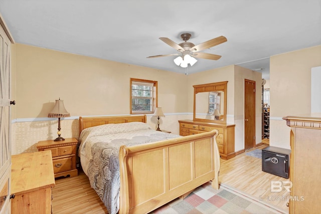 bedroom with ceiling fan and light wood-type flooring