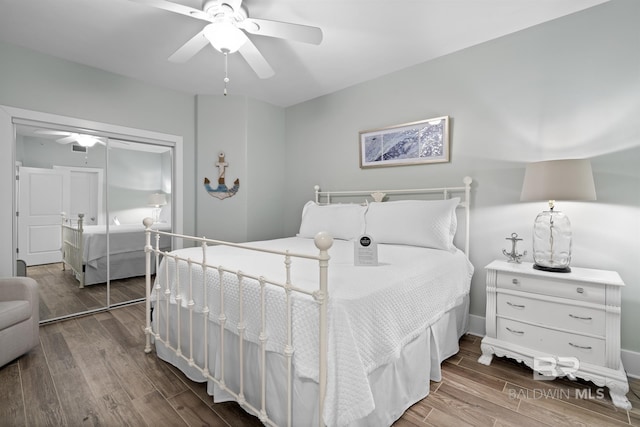 28107 Perdido Beach Blvd Unit D512, Orange Beach, AL 36561 - bedroom with wood finished floors, a closet, and a ceiling fan