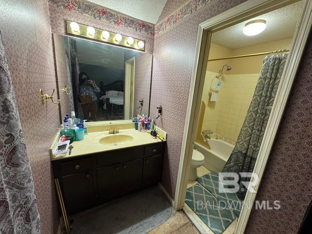 bathroom with toilet, shower / bath combo with shower curtain, vanity, a textured ceiling, and wallpapered walls