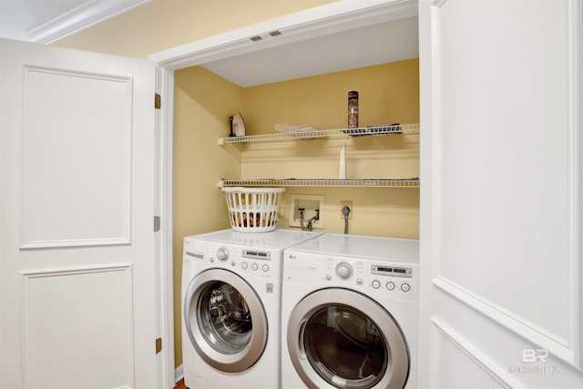 washroom with laundry area and washing machine and dryer