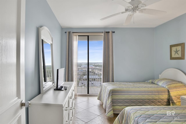 bedroom featuring access to outside, light tile patterned flooring, and a ceiling fan