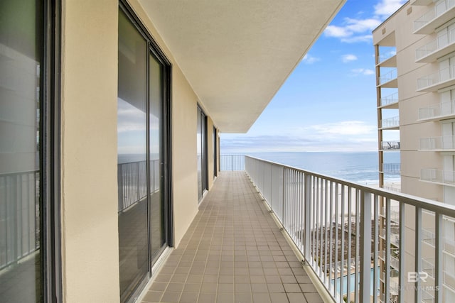 balcony featuring a water view