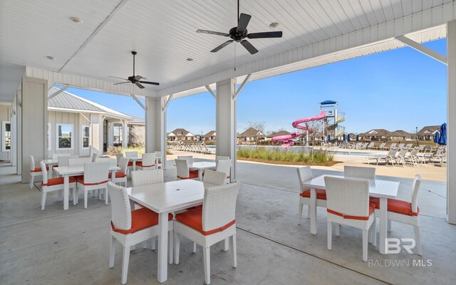 view of patio featuring a pool and ceiling fan