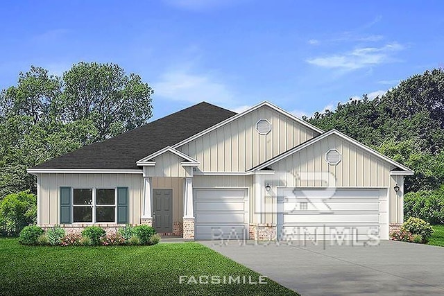 view of front of property featuring a garage and a front yard