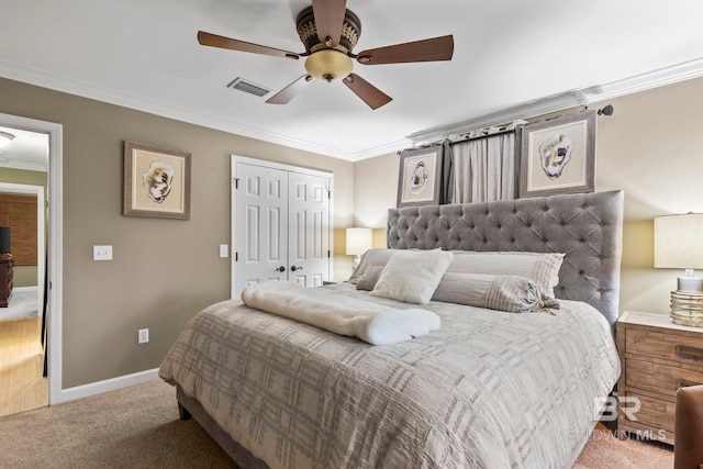 bedroom featuring ceiling fan, light colored carpet, visible vents, a closet, and ornamental molding