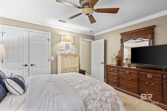 bedroom with a ceiling fan, light colored carpet, visible vents, a closet, and ornamental molding