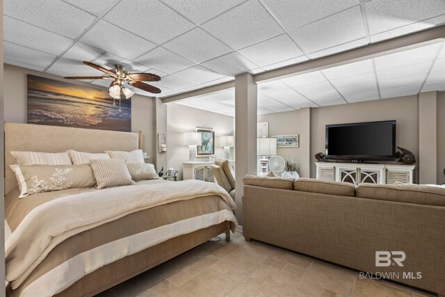 bedroom featuring a paneled ceiling and ceiling fan