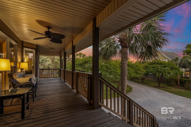 wooden terrace with a ceiling fan