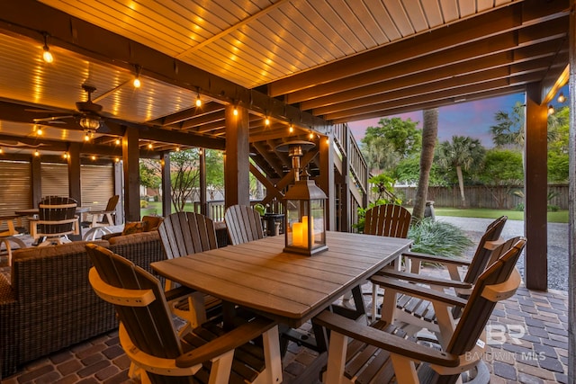 sunroom featuring a water view