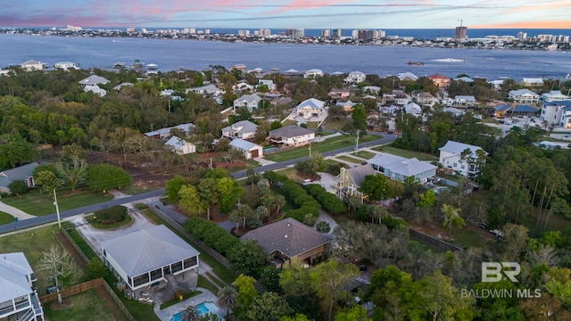 bird's eye view with a water view and a residential view