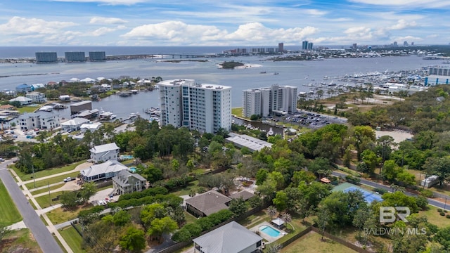 birds eye view of property with a view of city and a water view