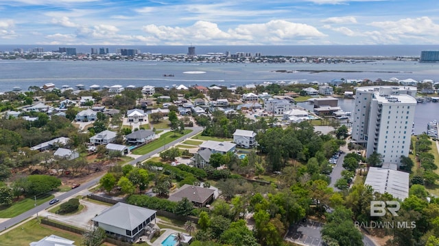drone / aerial view featuring a water view and a city view