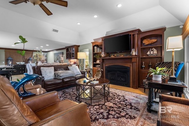living area featuring visible vents, lofted ceiling, wood finished floors, ceiling fan, and recessed lighting