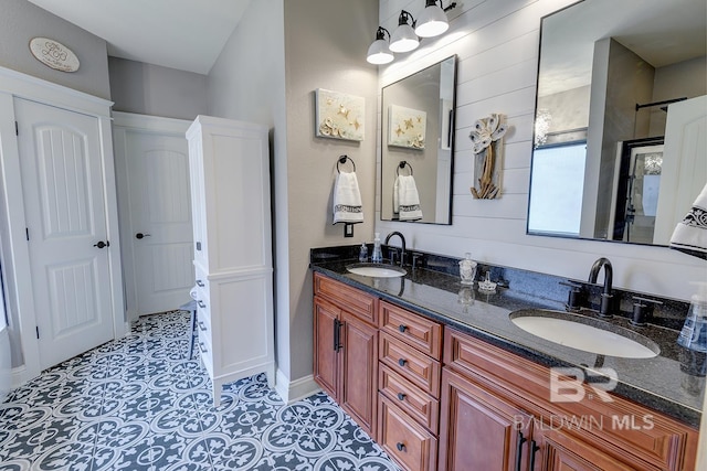 bathroom featuring dual vanity and tile flooring