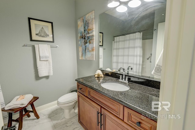 bathroom with tile floors, toilet, and oversized vanity