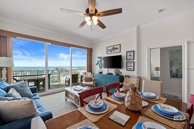 interior space with a ceiling fan, ornamental molding, and light wood-style floors
