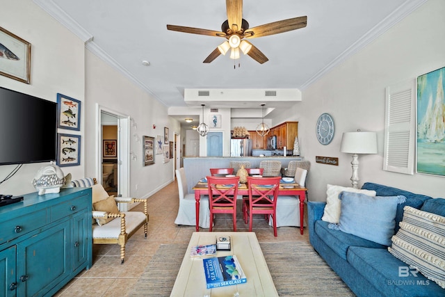living room featuring crown molding, a ceiling fan, visible vents, and light tile patterned floors