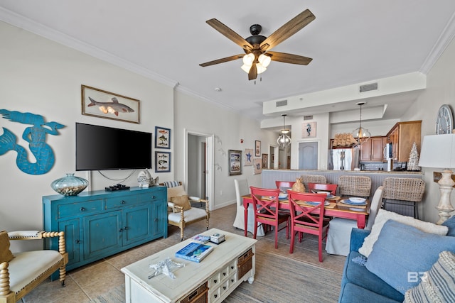 living area with crown molding, visible vents, and light tile patterned floors