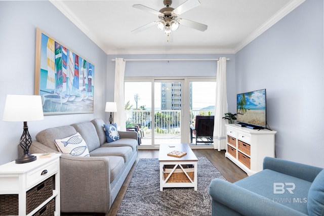 living area featuring ceiling fan, wood finished floors, and crown molding