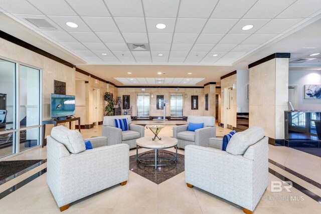 living room with tile patterned flooring, visible vents, and recessed lighting