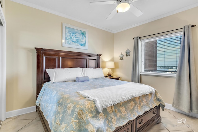 bedroom featuring light tile patterned floors, a ceiling fan, baseboards, and crown molding