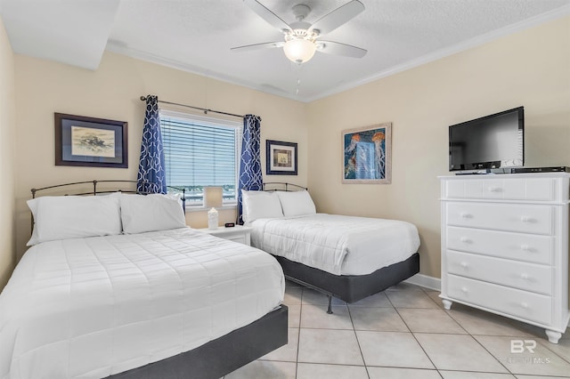 bedroom with ornamental molding, a textured ceiling, and light tile patterned flooring