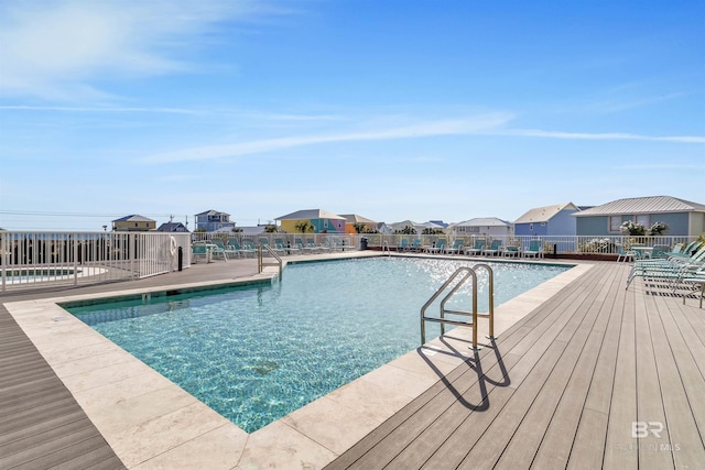 pool featuring a residential view and fence