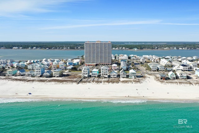 aerial view featuring a water view and a beach view