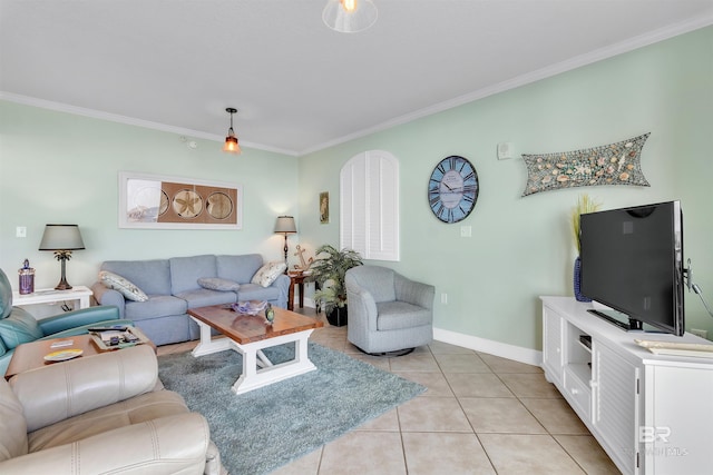 living room featuring light tile patterned floors, ornamental molding, and baseboards