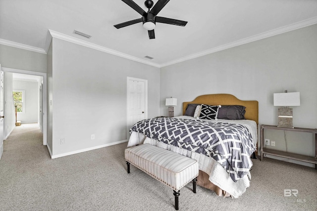 bedroom with carpet flooring, ornamental molding, baseboards, and ceiling fan