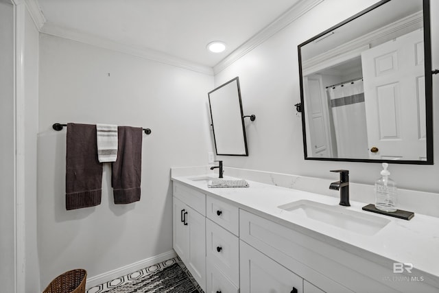 full bath with baseboards, double vanity, ornamental molding, and tile patterned floors