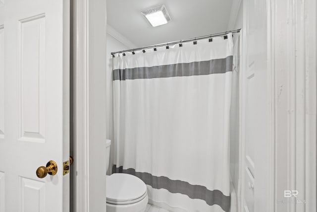 bathroom featuring ornamental molding, toilet, and a shower with shower curtain