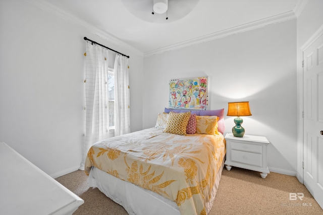 carpeted bedroom featuring ornamental molding, baseboards, and ceiling fan