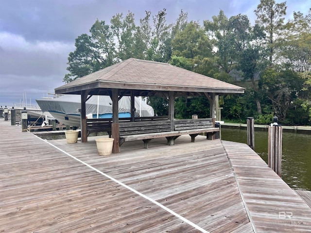 dock area with a water view