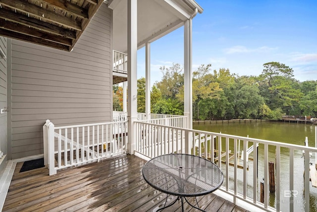 wooden deck featuring a water view