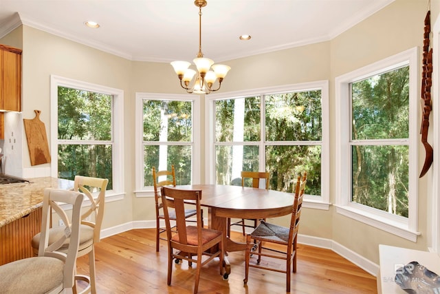 dining space featuring a healthy amount of sunlight and a notable chandelier