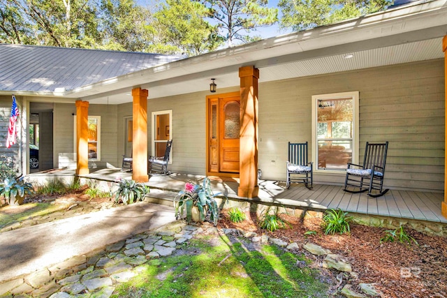 back of property with a porch