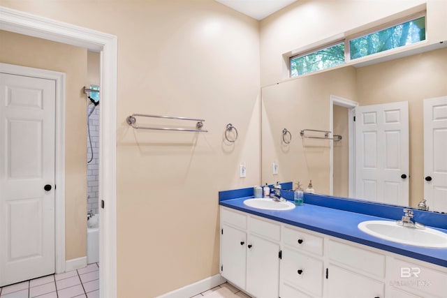 bathroom with tile patterned flooring, bathtub / shower combination, and vanity