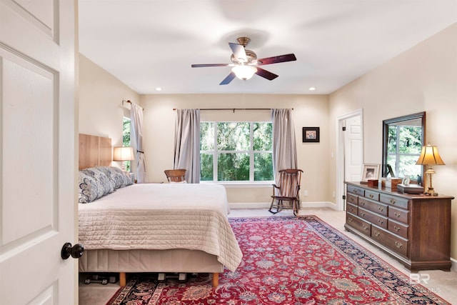 carpeted bedroom featuring ceiling fan